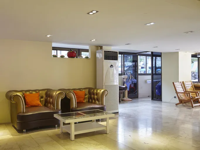Shared lounge with seating at Au Bon Hostel